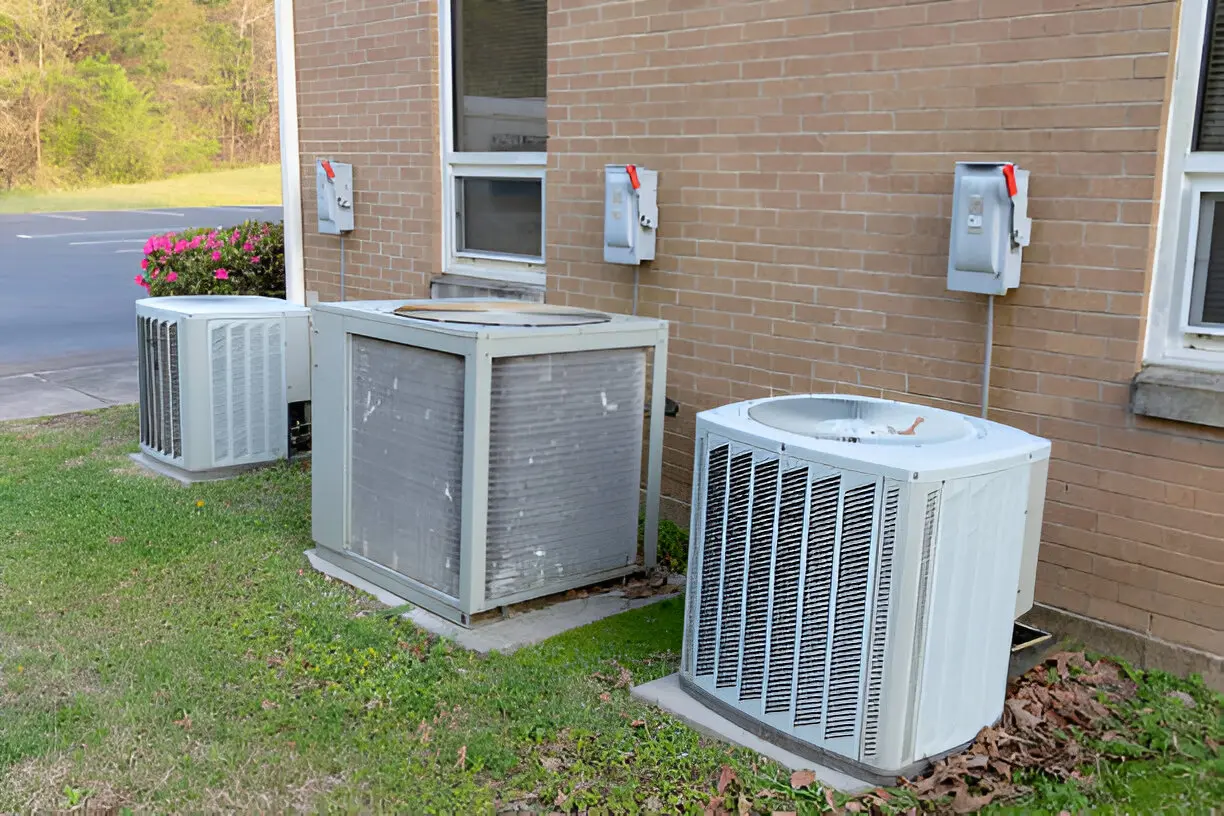 Home 16 Trained technician from FLAMINGO AIR AND HEAT, a trusted Air Conditioning Contractor in Delray Beach, addressing cooling issues promptly